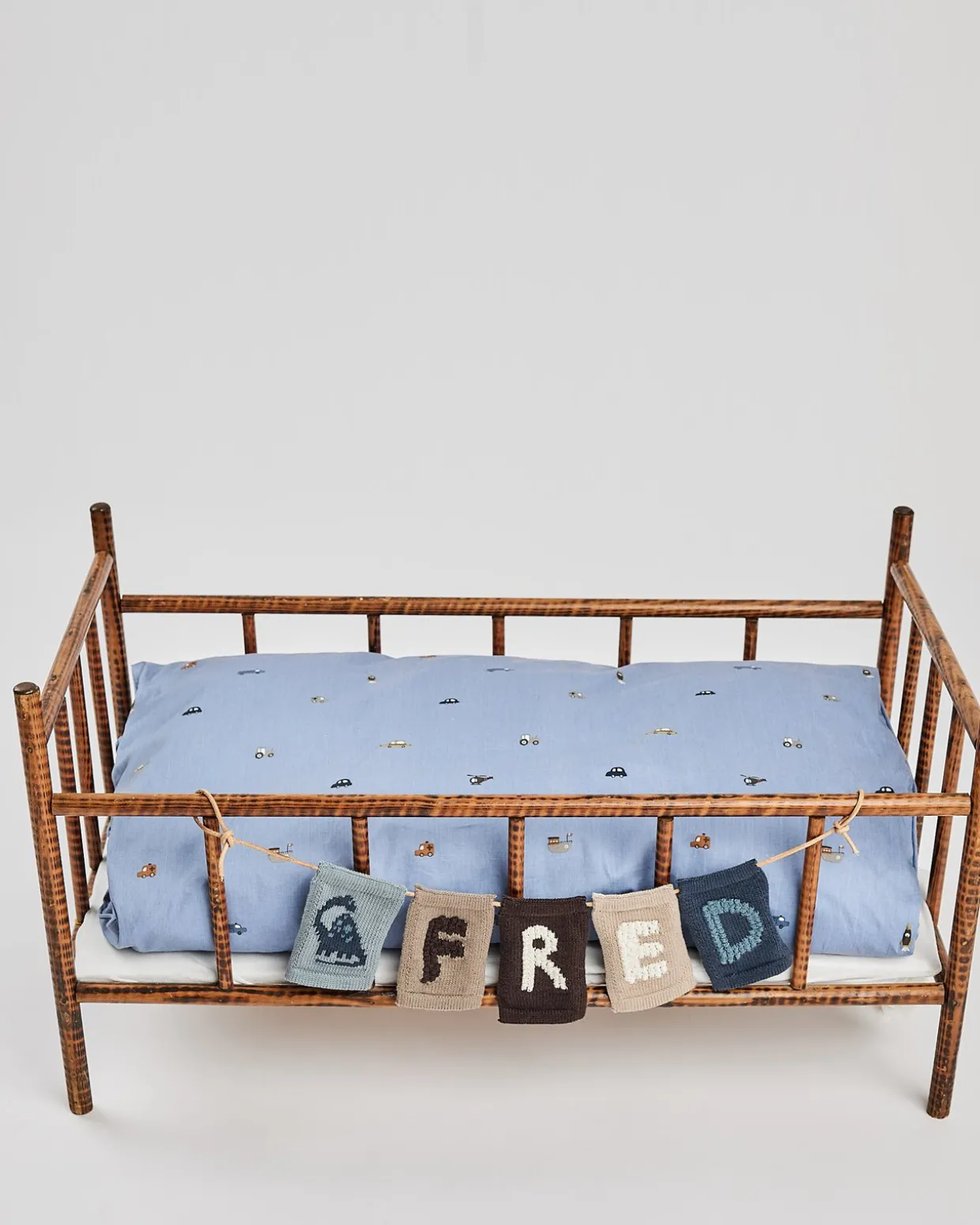 Strikket flag, dino, blå